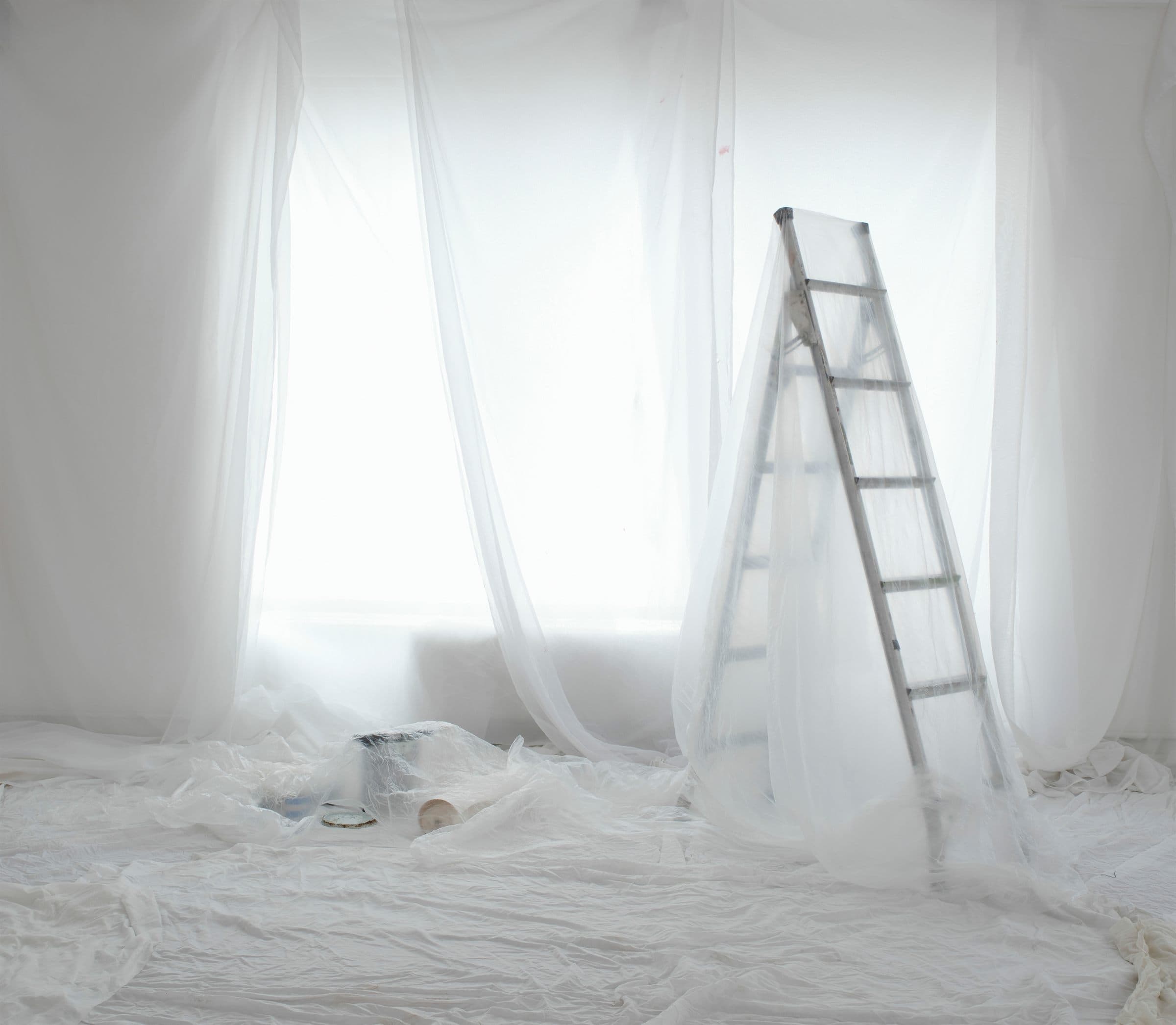 Post-Remediation Verification — An emptied room sealed in protective plastic sheeting with a step ladder in place, prepared for containment work (illustrative)